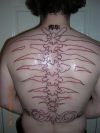 back bone tattoo on back